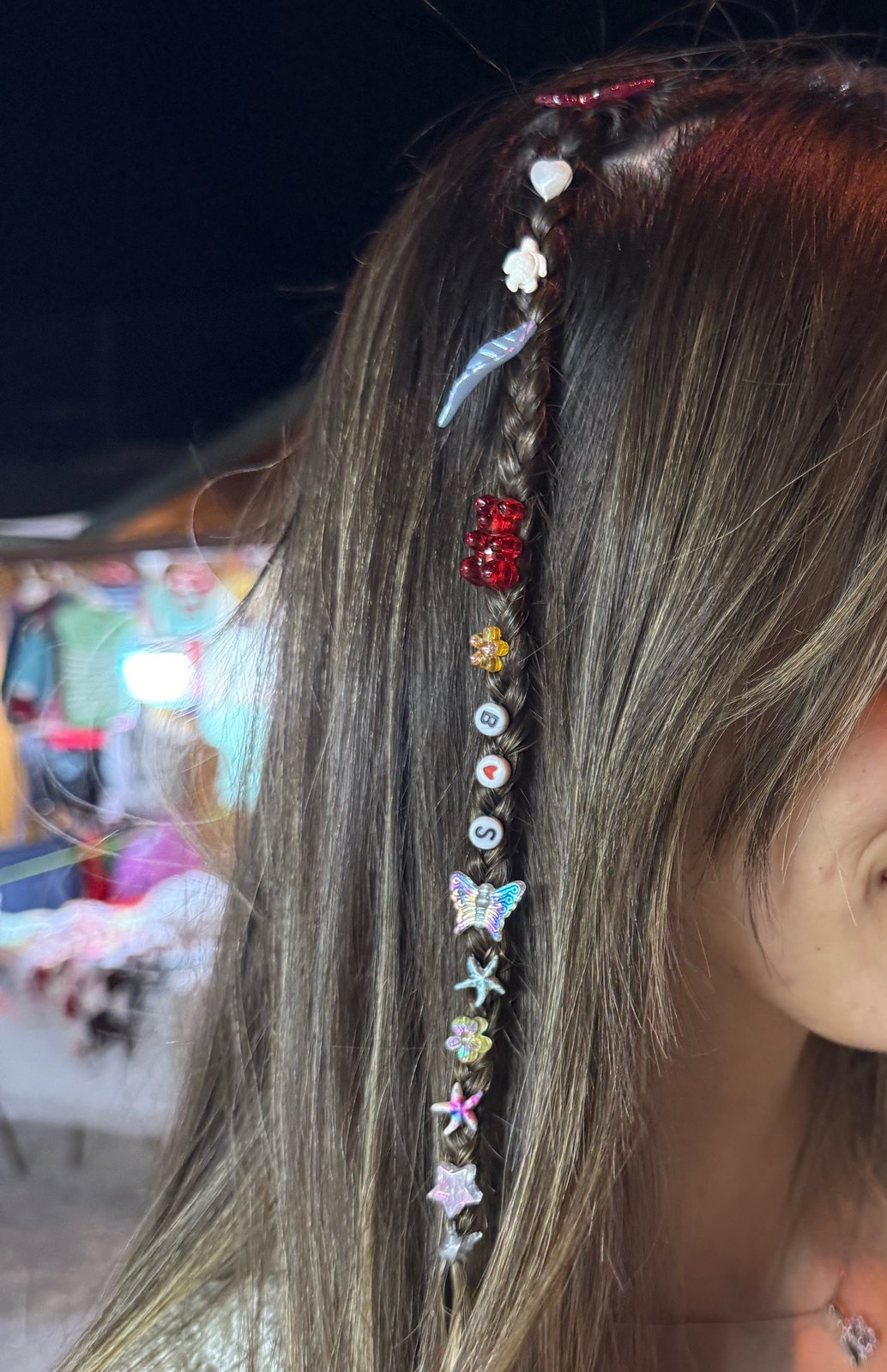 sat on a plastic stool for twenty minutes while a teenager clipped tiny stars into my hair and honestly? best twelve dollars i've spent all summer. do i keep it in for the wedding this weekend or is that pushing it
