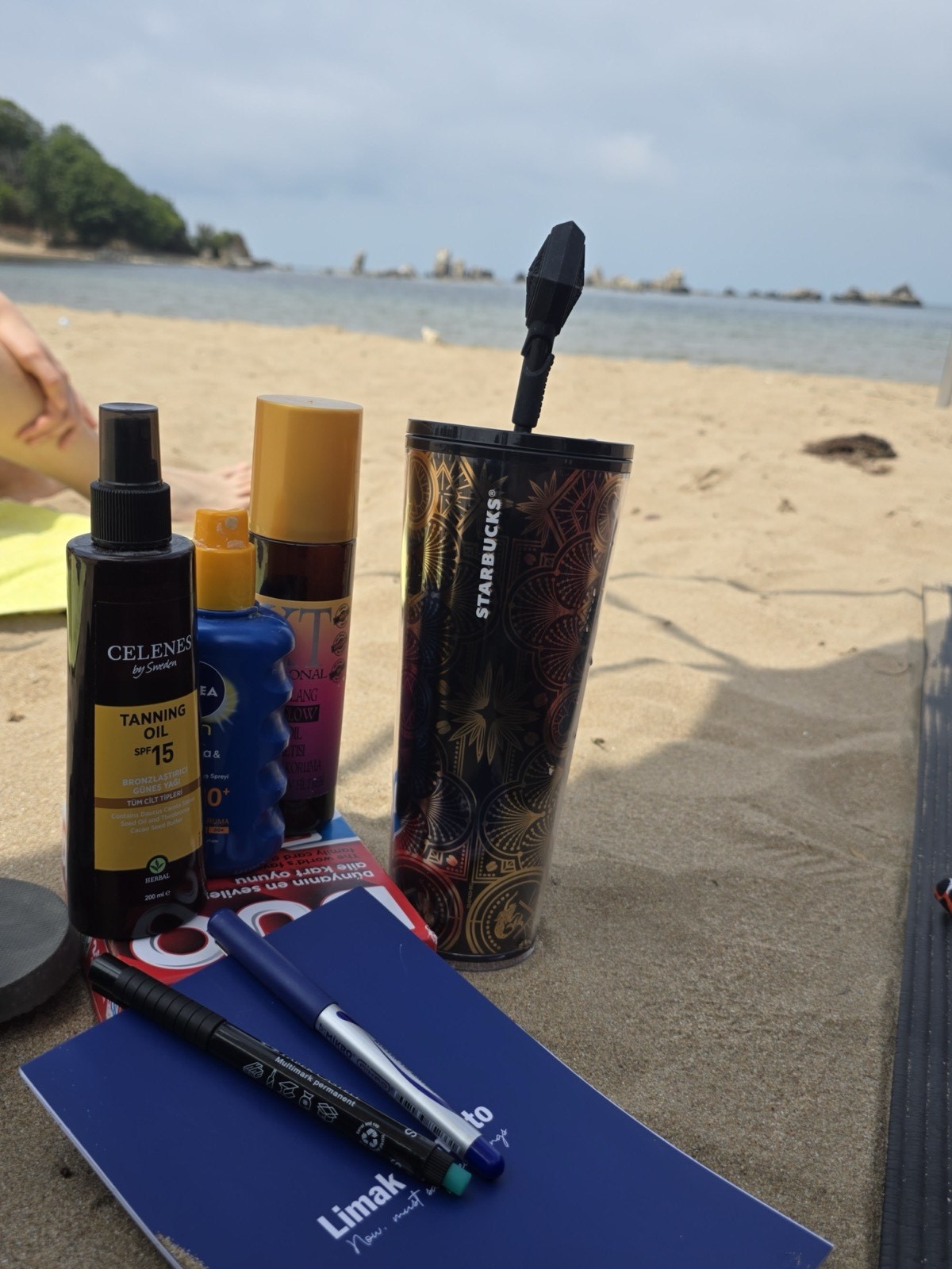 packed up the whole beach bag and set up camp — tanning oil, an iced coffee, UNO, and absolutely zero plans 🌊☀️ this is my idea of a perfect day off. what's the ONE thing that has to be in your beach bag or it doesn't count as a real beach day??