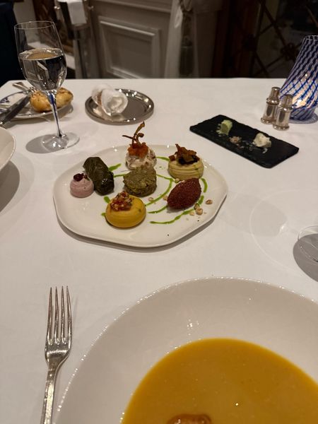 course after course with THIS view 🌃✨ the pumpkin soup, the little tasting plate, all of it felt unreal. i genuinely didn't know what half of it was but it was incredible. when's the last time someone spoiled you like this?? swipe for the tasting plate