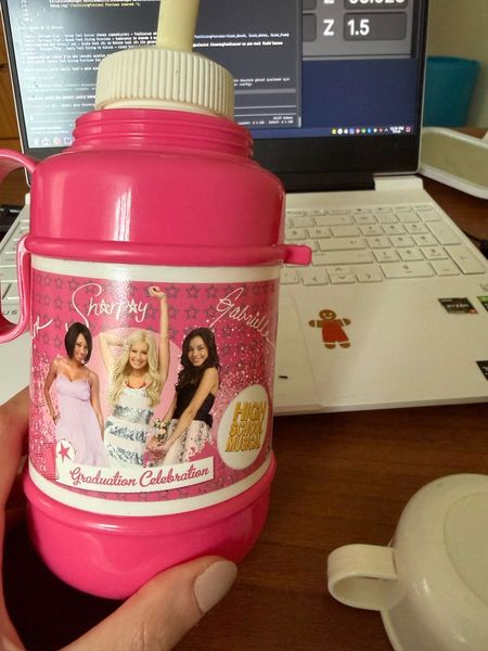 was cleaning out the storage room and found my old HSM thermos… sharpay AND gabriella, graduation celebration edition. instantly felt 9 years old again. please tell me someone else had this exact one 💗